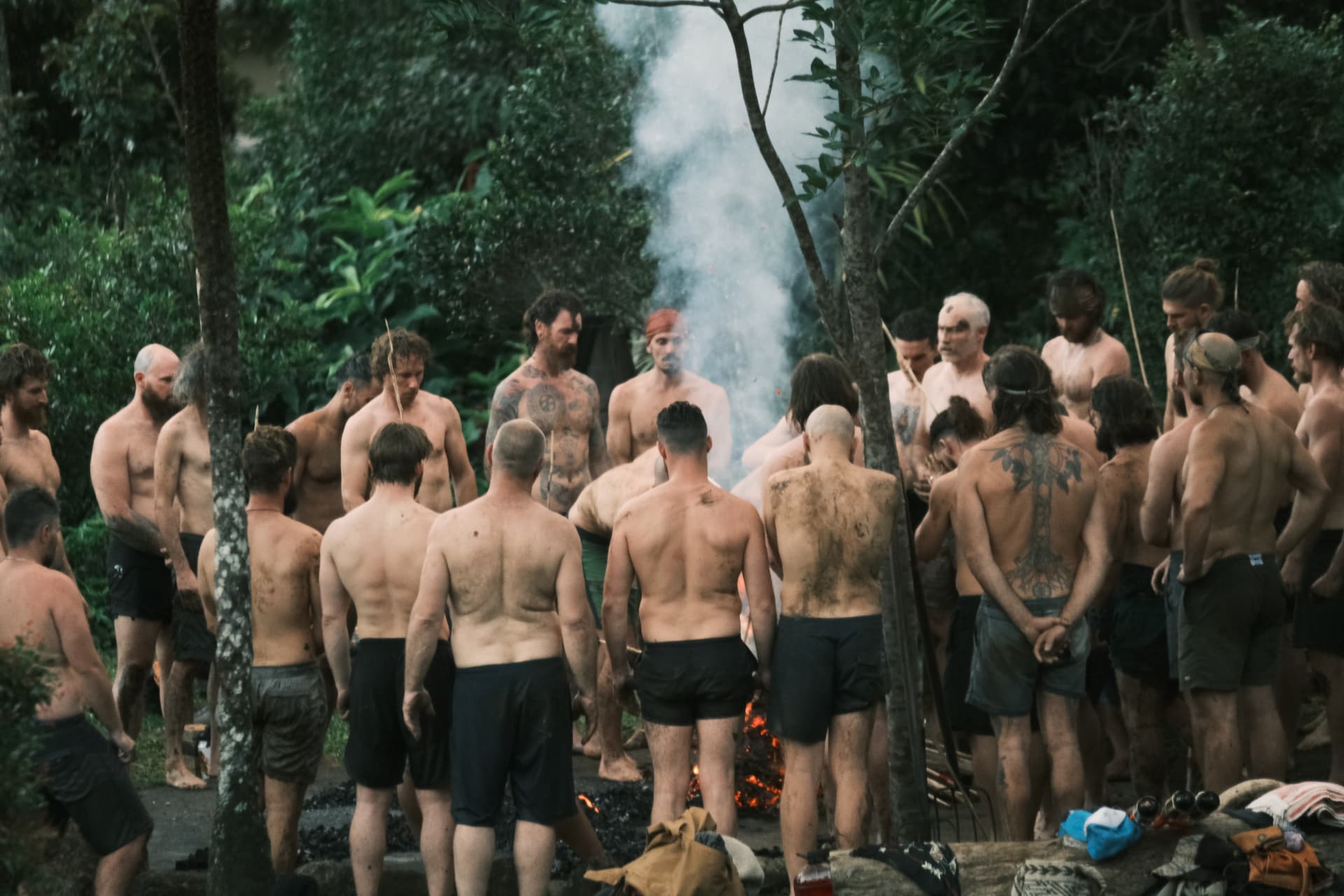 Men gathered around the ceremonial fire